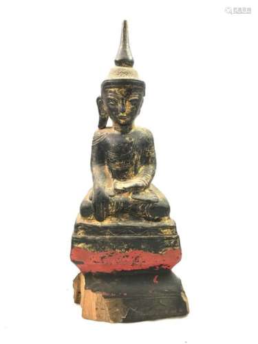 A Buddha, in golden wood, sitting in meditation, in bhumisparsha mudra