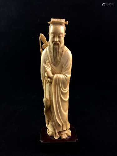 Ivory subject depicting a Tao sage holding a flycatcher with a sword in his back. China, circa 1900.