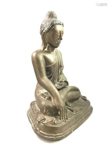 An important bronze Buddha with a brown patina, sitting in meditation, in bhumisparsha mudra