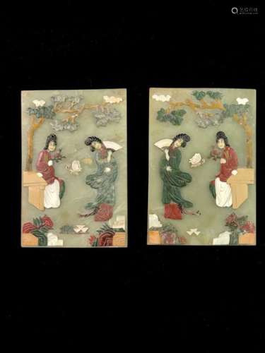Pair of polychrome hard stone plates and bas-reliefs depicting young women in the garden. Japan late 19th to early 20th century. Some missing parts.