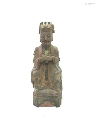 Polychrome carved wooden subject representing a seated dignitary. Cavity on the back. Height: 24.8 cm. Width : 10 cm. Depth : 5.9 cm. Wears and small lacks.