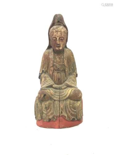 Polychrome carved wooden subject representing a Buddha sitting in meditation. Cavity in the back. Height: 32, 8 cm. Width: 15.4 cm. Depth : 10 cm. Cracks and wear.