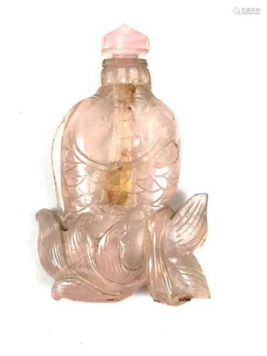 Rose quartz bottle. Representing a carp emerging from the waves. Wooden base with openwork shape. Height 8 cm, Width 5 cm, Depth 1 cm...