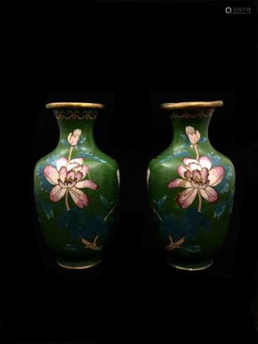 Set of three baluster vases in cloisonné enamel on copper decorated with flowers, birds, furniture and masks. Height. 18 cm and 19.5 cm. Shock and small accidents.