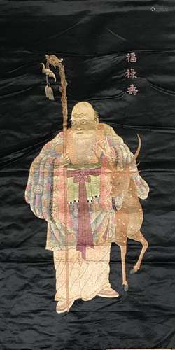 Large black silk panel embroidered with polychrome silk threads, representing Laozi holding the pilgrim's staff, accompanied by his deer and an auspicious inscription, Fu Lu Shou