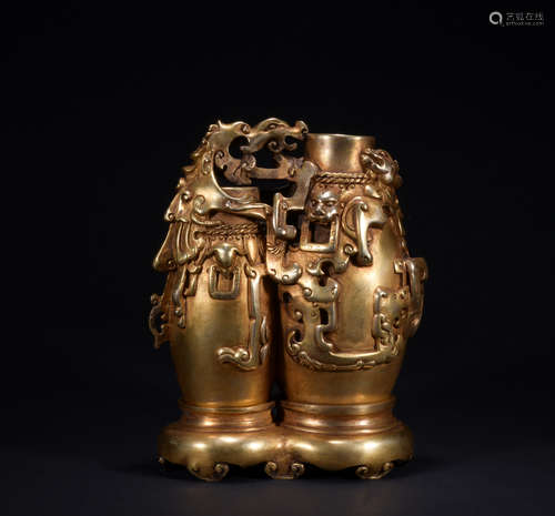 A gilt-bronze beast ornament