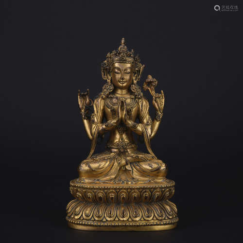 A gilt bronze statue of Four-armed Gwan Yin