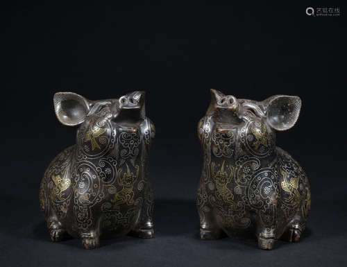 A pair of bronze pig ware with gold and silver