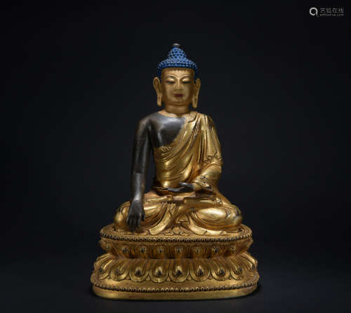 A gilt-bronze figure of Sakyamumi