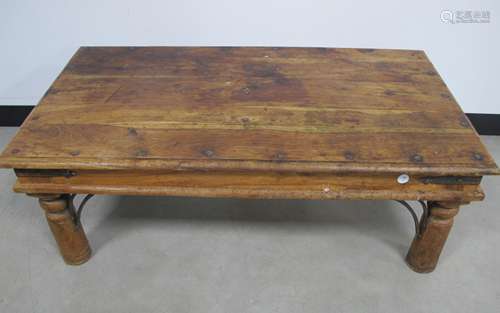 A contemporary Indonesian hardwood coffee table, with metal banding and studding, rectangular