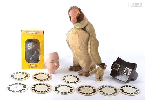 A boxed 20th Century Pelham puppet of a cat, together with a 20th Century teddy Penguin toy and baby