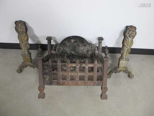 A cast iron fire grate, with a decorative back panel of a inn scene with seated figures, 40cm x 27cm