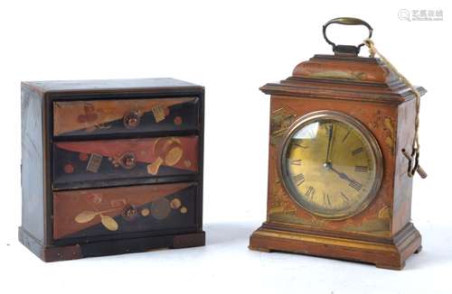 A Japanese design or 'Japanned' clock with French movement, the case decorated with traditional