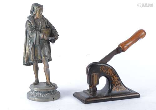 A 20th Century spelter figure of a Renaissance gentleman probably Leonardo Da Vinci with sketchbook,