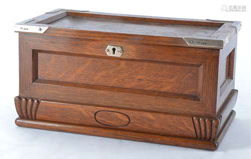 A 20th Century oak humidor box with silver mountings, hallmarked for London, the retailer's plaque