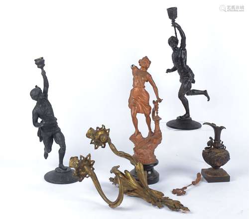 A pair of 19th Century mixed metal candlestick holders in the form of Blackamoors or Turks in the