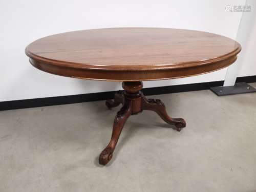 A 19th Century mahogany oval tilt top table, with carved tripod base. 127cm x 105cm x 67cm