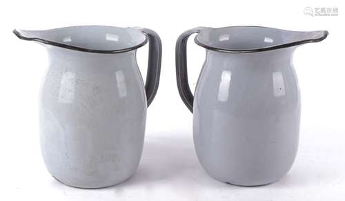 A pair of 20th Century enamel kitchen jugs from a US military canteen, the bases marked 'U.S. G.P. &