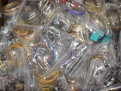 A quantity assorted costume jewellery bangles and bracelets, most individually bagged, to include