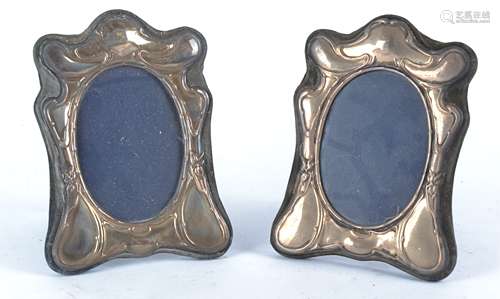 A pair of hallmarked silver Art Nouveau style frames with sinuous organic decoration, by London