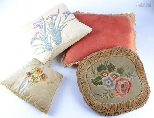 A selection of vintage and contemporary cushions, cotton, velvet and woven fabric examples, with