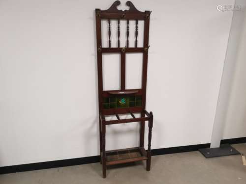 A mahogany hall stand with green tile inserts, 188cm x 56cm x 26cm