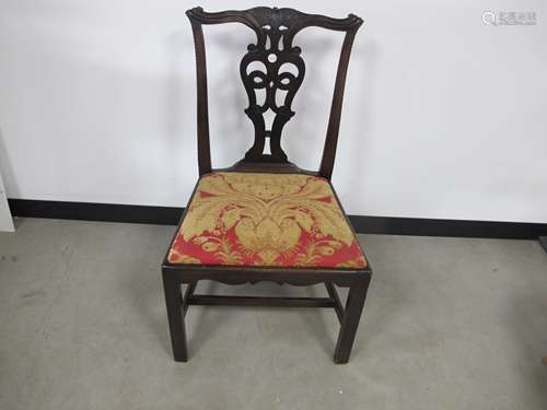 A 19th century mahogany Chippendale style chair, pierces splat back, shaped front rail, red and gold