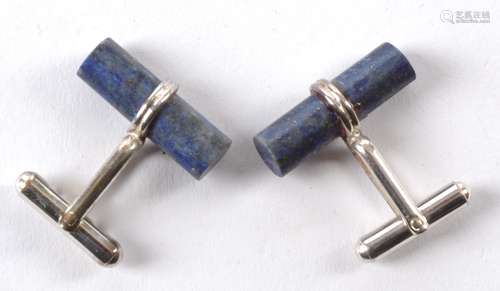 A pair of near cylindrical lapis lazuli mounted cufflinks, (pair)