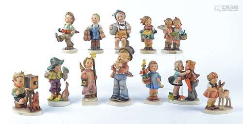 Eight Goebel Hummel figures, comprising 'Christmas Song' no.343, 'The Photographer' no.178, '