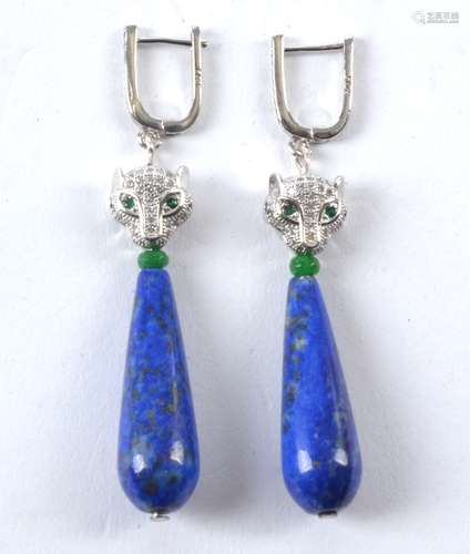 A pair of teardrop shaped lapis lazuli earrings, with panther's head terminals and green coloured