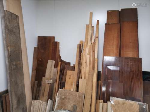 An extensive collection of planks, raw timber and spare furniture parts, to include oak, cherry,