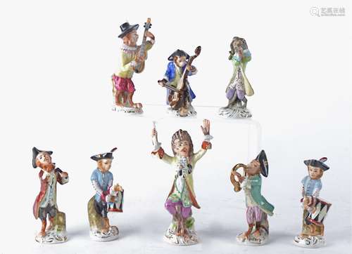 A 20th Century Continental porcelain monkey band after the original, with conductor, drummer,