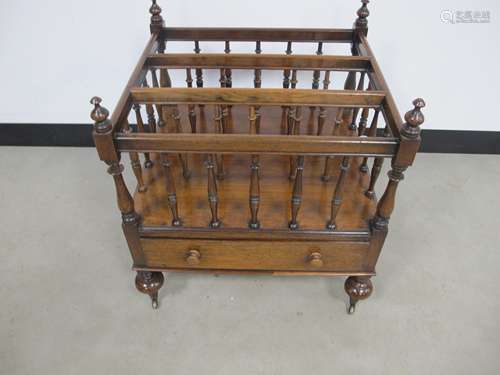 A 19th century rosewood Canterbury, three section with turned spindles, shaped top rails with turned