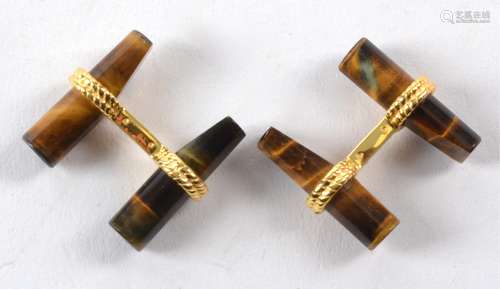 A pair of tigers eye cufflinks, with near cylindrical cuts in gilt rope twist mounts (pair)