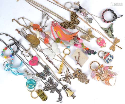 A collection of costume jewellery, beaded bracelets, keyrings, leather and metal necklaces, animal