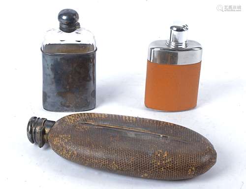 An early 20th Century snakeskin covered oval hip flask with hallmarked silver top, with indistinct