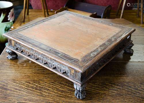 An Indian hardwood and metal mounted square table top stand, with painted red oak centre