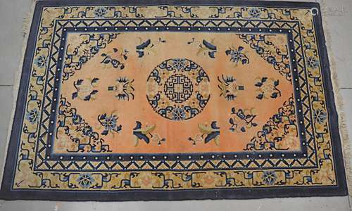 Four assorted small rugs, one on a peach ground with Oriental decoration, one on a beige ground with