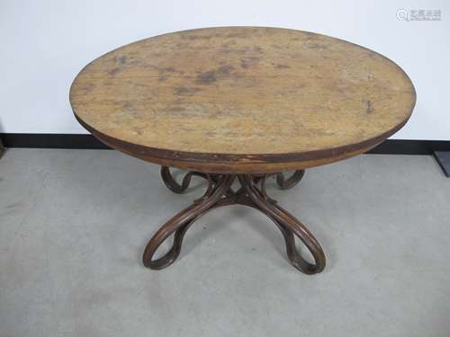 A 19th century oval table, veneered ok top supported on a bentwood base, believed to be a