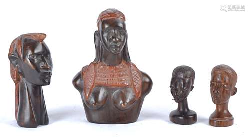 Four 20th Century African tribal ebonised treen carvings, three busts and one of the upper torso,