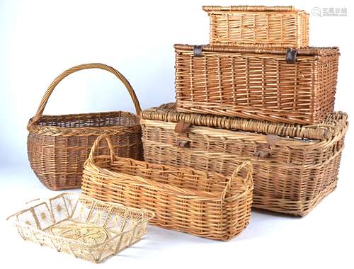 A collection of interior wicker objects to include seven baskets of assorted shapes and sizes,