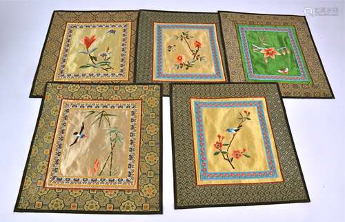 Twelve 20th Century Chinese embroidered place mats / settings, with central panels of insects and