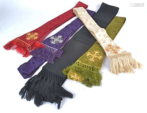 Five clerical stoles, four featuring stitched and beaded crosses and the ends bearing tassels,