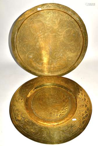 Two substantial 20th Century Eastern brass chargers, one Chinese with central decoration of