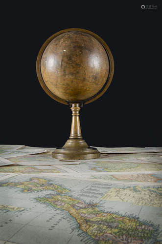 A Victorian terrestrial globe dating between 1840 and 1852, with brass bracket and stand,