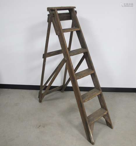 A vintage wooden pitch pine step ladder, six steps with a metal G A Jones patent label, height 147cm