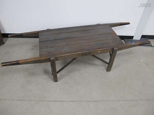 An antique stained pitch pine twin handled portable work top, with four rectangular supports and