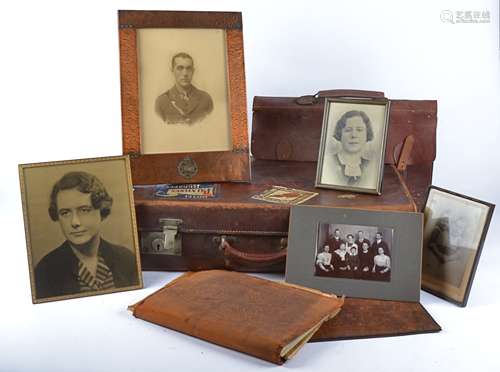 An early 20th Century travel trunk containing a framed military portrait in a regimental frame '