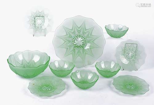 A 20th Century moulded green glass pudding set comprised of a bowl and stand, diameter 27cm,