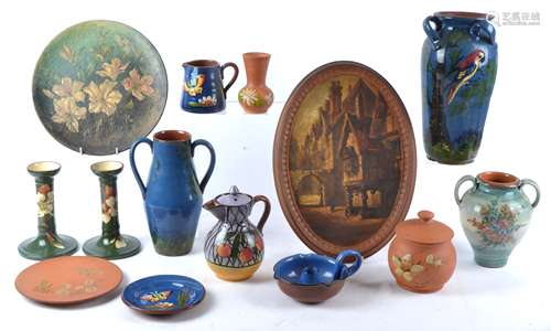 A group of Torquay Devon Ware pottery of various designs to include a group of wares with exotic